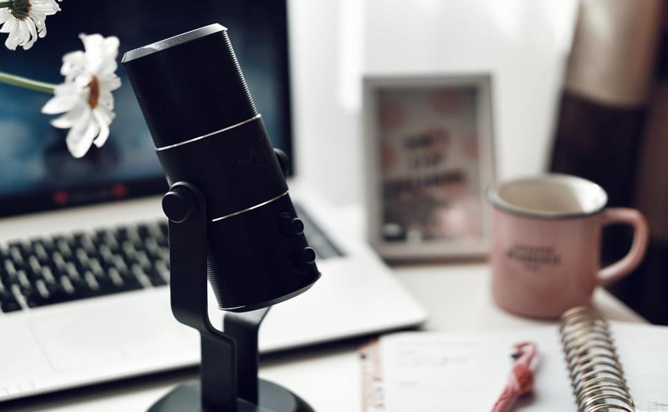 A microphone on a writing desk
