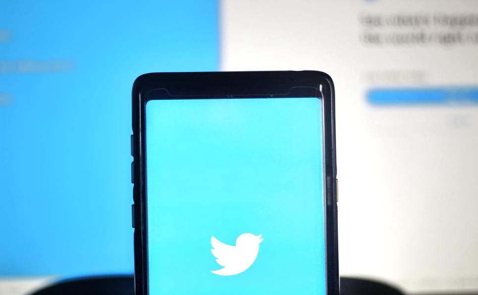 A phone with the blue Twitter bird to represent how to find literary agents on Twitter