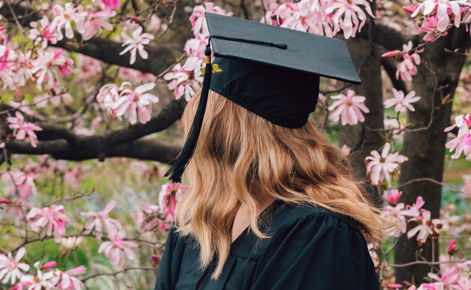 Graduate and pink flowers