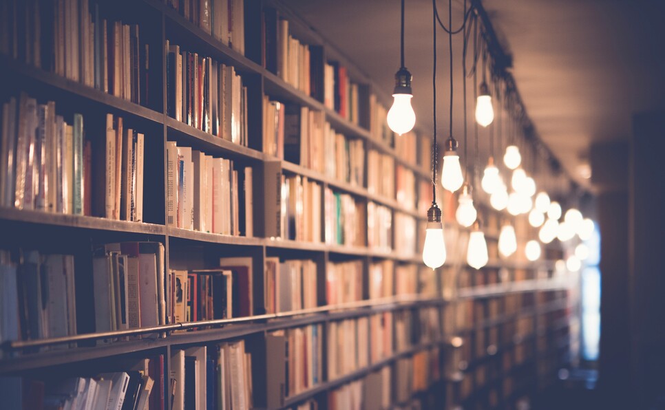 Lightbulbs and books indicating ways to market your book for free
